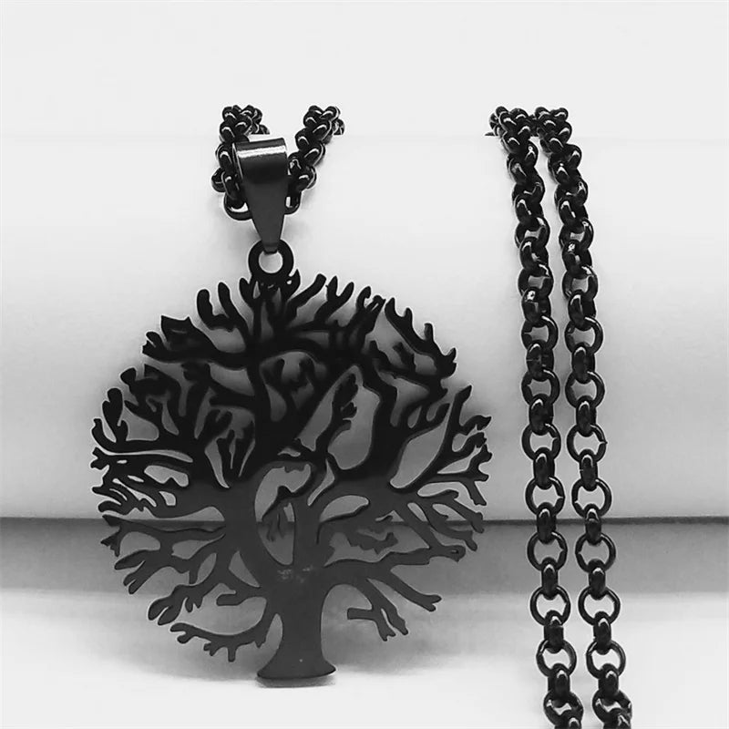 Black tree-shaped pendant with a chain on a white background