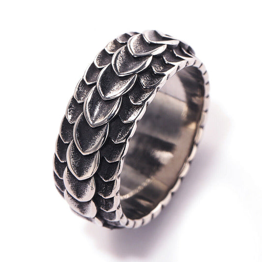 A stainless steel ring with intricate dragon carvings, featuring a vintage silver finish.