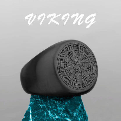 Black ring with engraved design on a gray background, featuring the word 'Viking'.