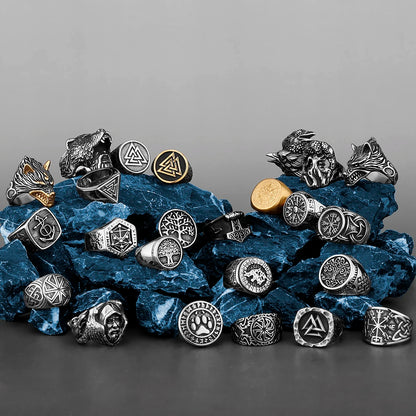 Collection of various rings on a textured surface with a gray background