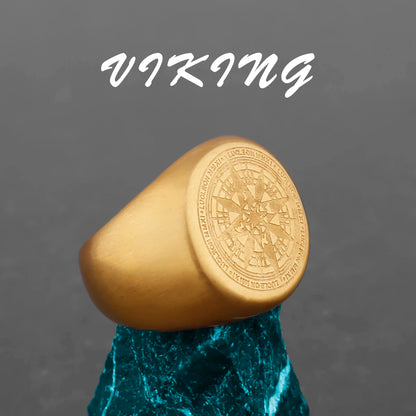 Gold ring with compass design on a gray background with 'Viking' text.