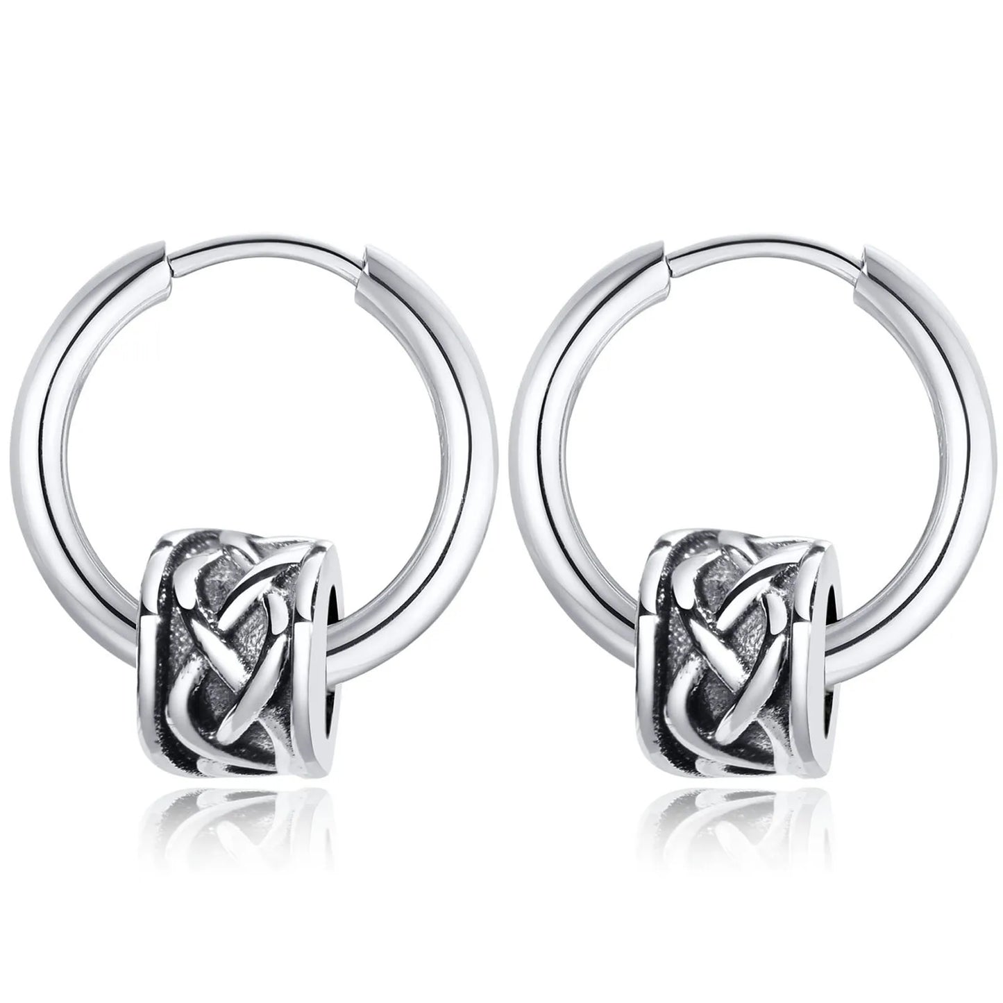 Pair of silver hoop earrings with an intricate knot design on a white background