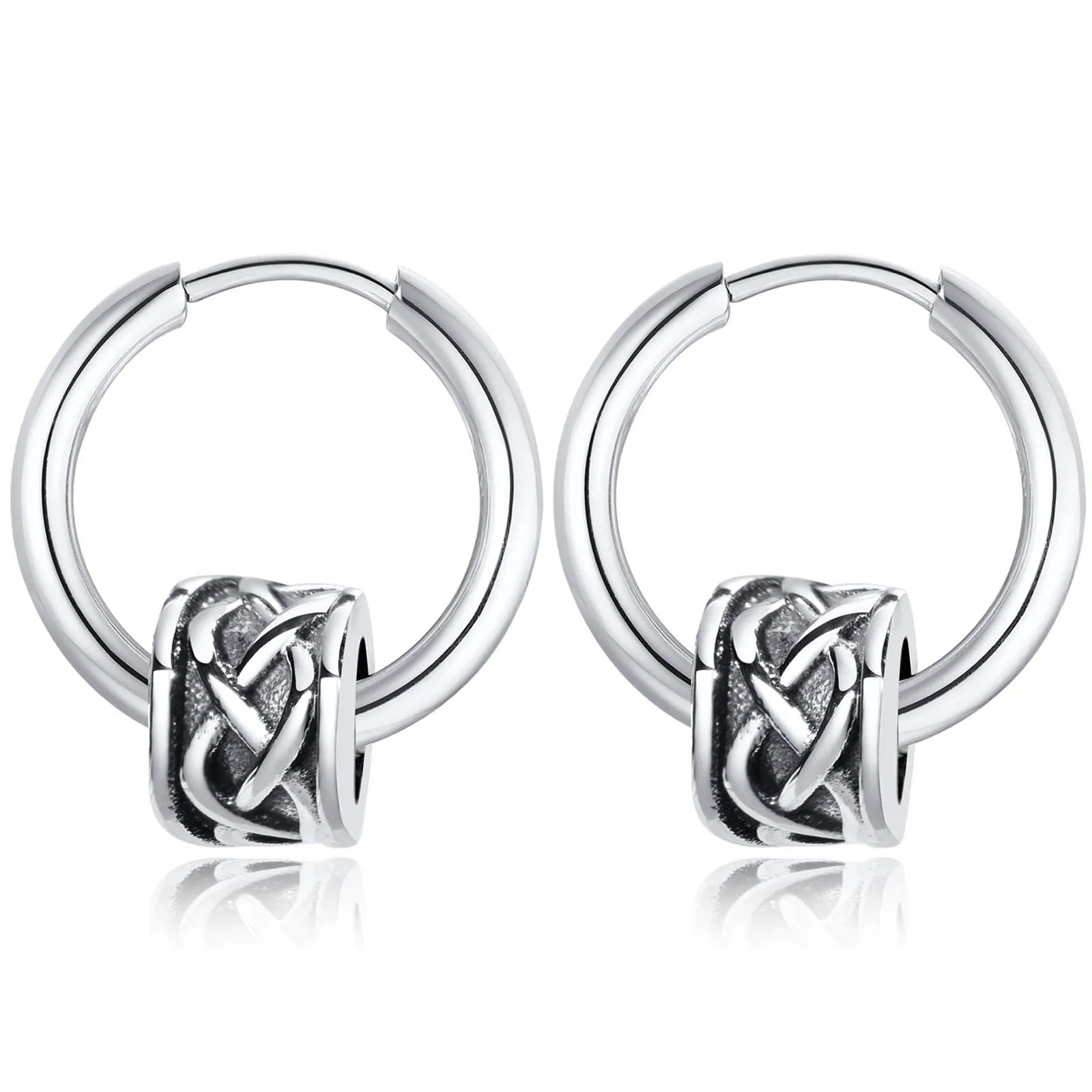 Pair of silver hoop earrings with an intricate knot design on a white background