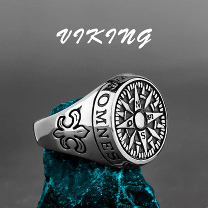 Silver Viking ring with compass design on a dark background