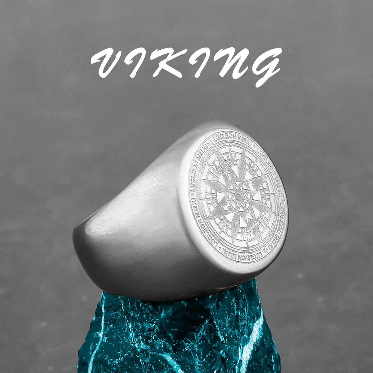 Silver ring with intricate design on a gray background with 'Viking' text