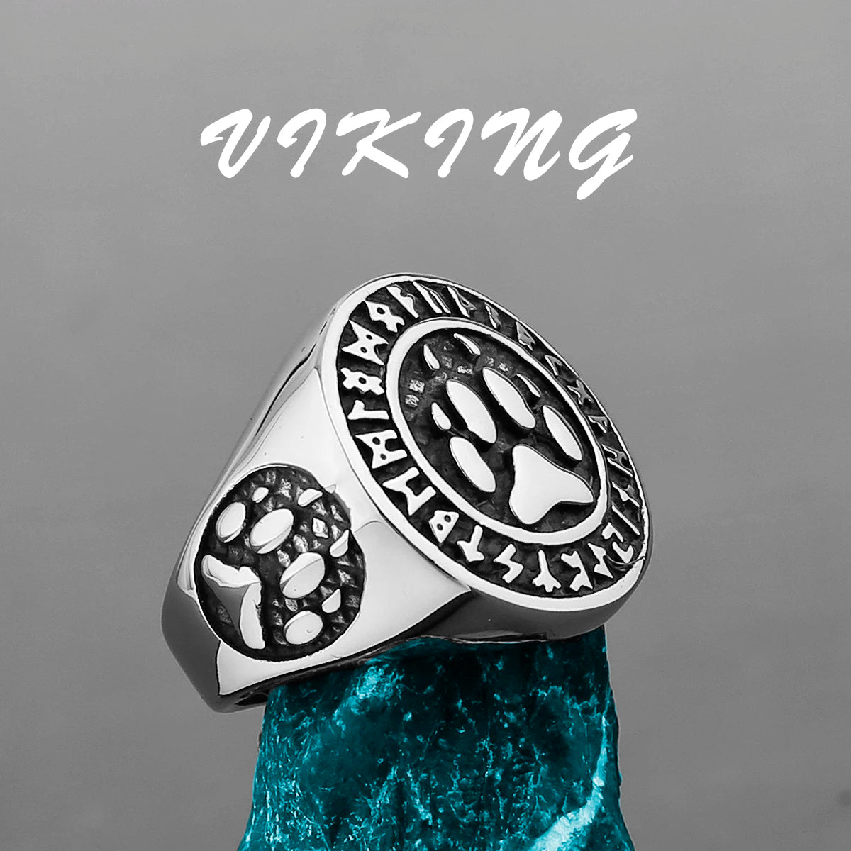 Silver ring with paw print design on a gray background, featuring the word 'Viking'.