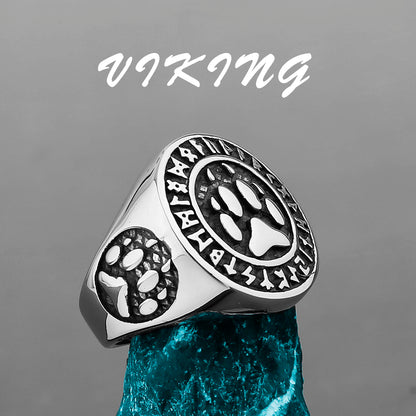 Silver ring with paw print design on a gray background, featuring the word 'Viking'.