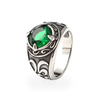 Stainless steel Viking ring with green gemstone and swirling knotwork engravings.