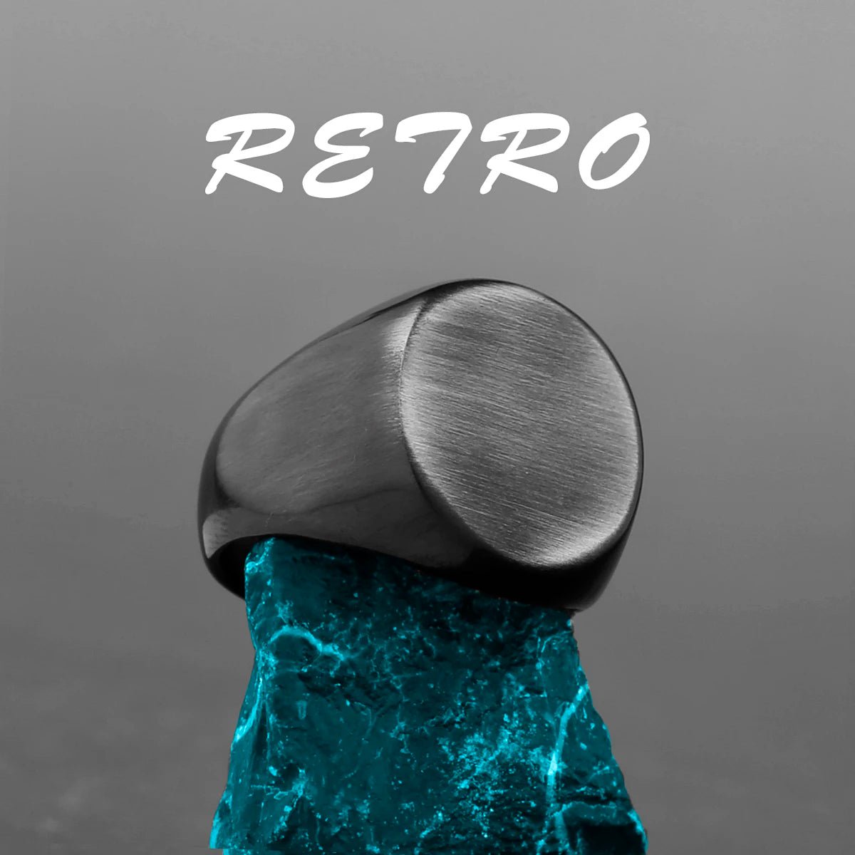 Retro brushed stainless steel Viking ring displayed on a blue crystal base.