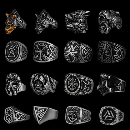 A collection of Viking-themed rings displayed on a black background, showcasing detailed Norse designs such as Fenrir, Odin's ravens, Valknut, Vegvísir, and intricate knotwork. The rings are crafted in black, silver, and gold finishes, embodying ancient Scandinavian symbolism.