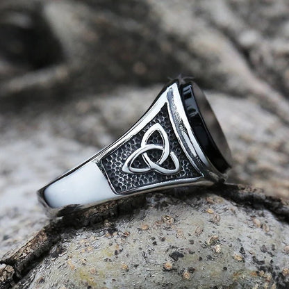 Close-up side view of the Trinity of Power Ring highlighting the detailed Trinity Knot engraving.