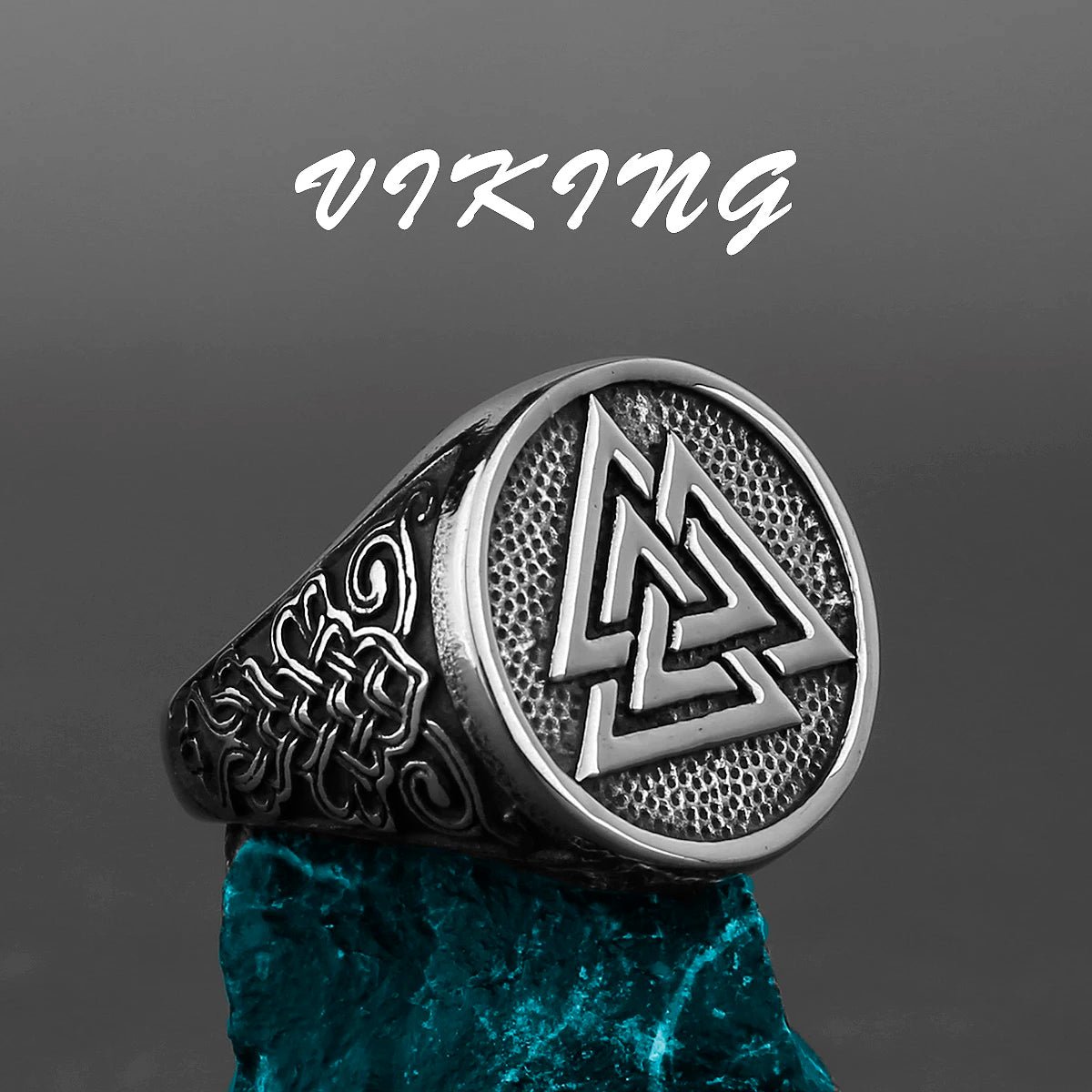 Viking ring featuring the Valknut symbol with intricate engraved patterns on the sides, crafted in stainless steel.